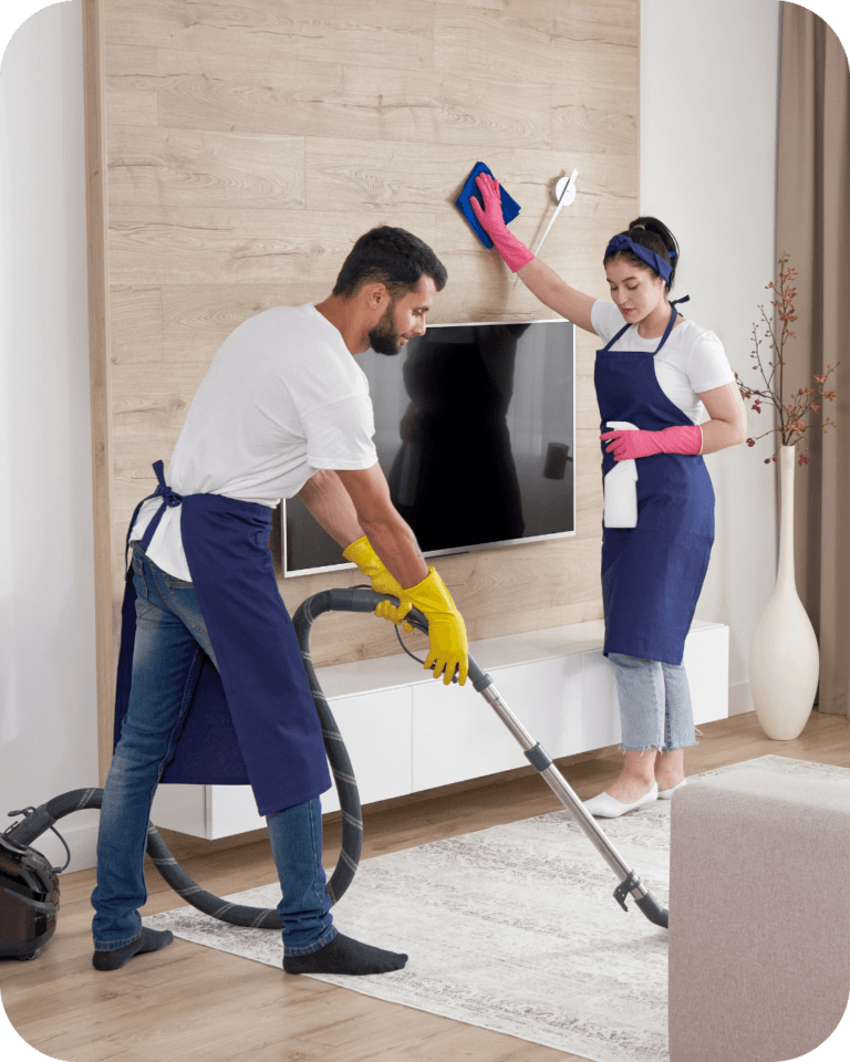 Professional deep cleaning in Santa Rosa: cleaners scrubbing a kitchen tile floor thoroughly using a brushes and cleaning solution.