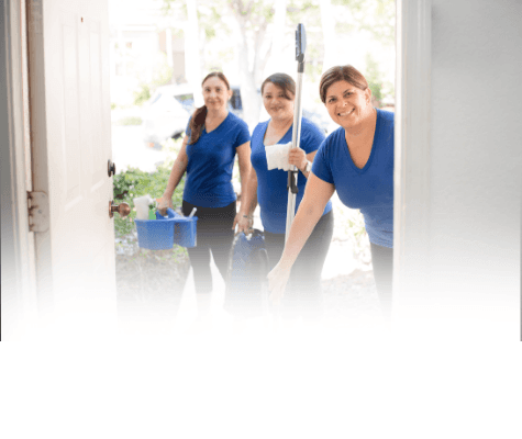 Same-Day Cleaning services shown with three professional cleaners standing at the front door of a home, ready to start their work.